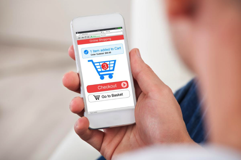 Man holding mobile phone shopping online and checking out